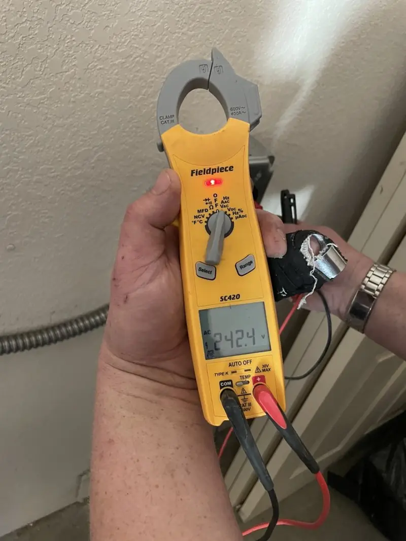 Voltage testing with clamp meter during Ceiling Fan Installation in Niagara Falls